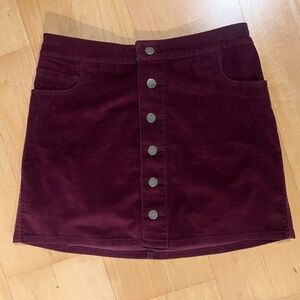 Cranberry corduroy skirt with button detail